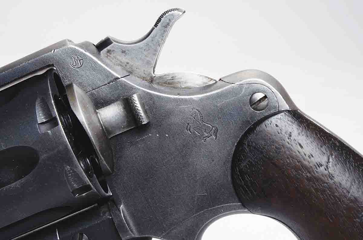 The government inspector marking is found on the frame just in front of the hammer and the “Rampant Colt” is behind the cylinder release button.